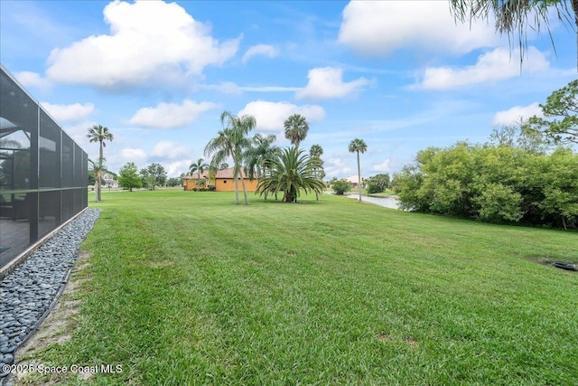 912 Hialeah St, Rockledge, FL 32955 - view of green lawn with a lanai and a water view