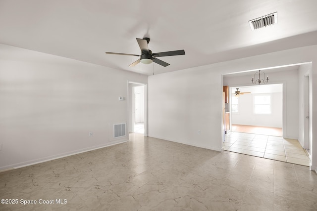 418 N Fiske Blvd, Cocoa, FL 32922 - spare room with ceiling fan, baseboards, and a chandelier
