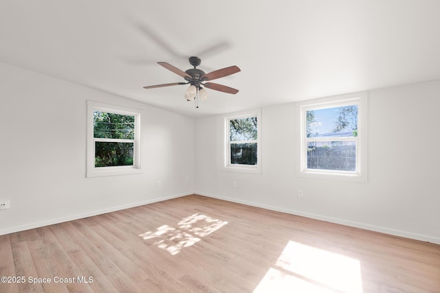418 N Fiske Blvd, Cocoa, FL 32922 - empty room with healthy amount of natural light, light wood-style flooring, and ceiling fan