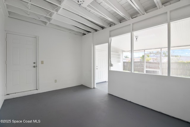 418 N Fiske Blvd, Cocoa, FL 32922 - spare room featuring concrete floors, plenty of natural light, and beam ceiling