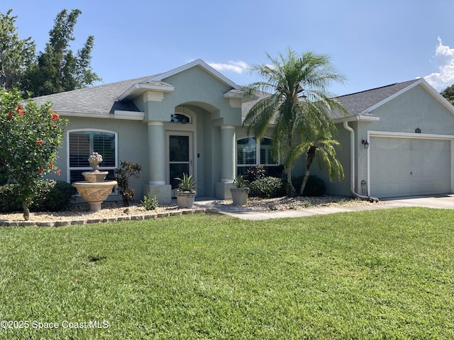 971 Sabal Grove Dr, Rockledge, FL 32955 - view of front of home featuring stucco siding, a garage, a front lawn, and roof with shingles
