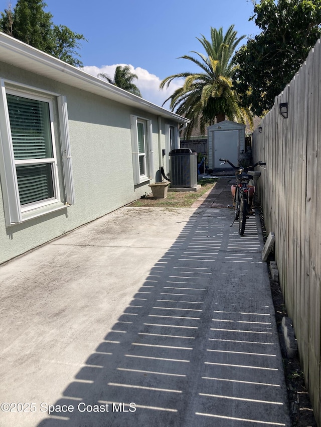 971 Sabal Grove Dr, Rockledge, FL 32955 - fenced backyard featuring a storage shed and a patio area