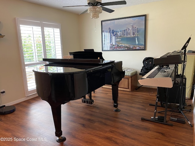 971 Sabal Grove Dr, Rockledge, FL 32955 - sitting room with wood finished floors, ceiling fan, and a textured ceiling