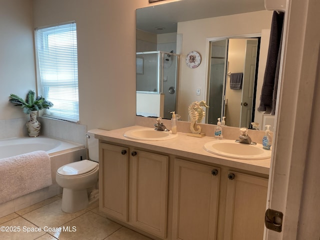 971 Sabal Grove Dr, Rockledge, FL 32955 - bathroom with a stall shower, a garden tub, tile patterned floors, and double vanity