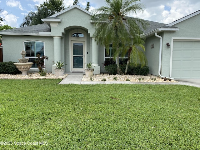971 Sabal Grove Dr, Rockledge, FL 32955 - view of front of property featuring stucco siding, a shingled roof, a front lawn, and an attached garage