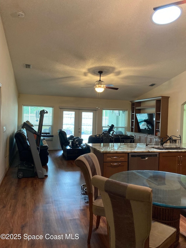 971 Sabal Grove Dr, Rockledge, FL 32955 - kitchen featuring stainless steel dishwasher, open floor plan, dark wood-style floors, a ceiling fan, and a textured ceiling