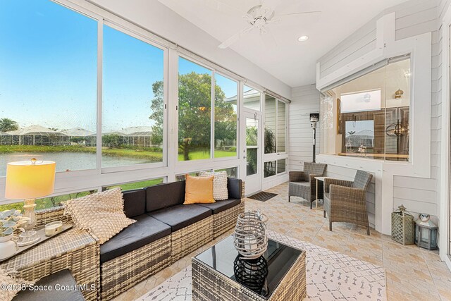 1172 Vestavia Cir, Melbourne, FL 32940 - sunroom with outdoor lounge area, a ceiling fan, and a water view