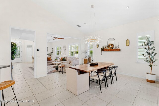1172 Vestavia Cir, Melbourne, FL 32940 - dining room with vaulted ceiling, light tile patterned floors, a chandelier, baseboards, and a ceiling fan