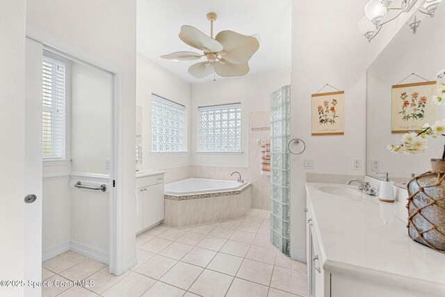 1172 Vestavia Cir, Melbourne, FL 32940 - bathroom featuring plenty of natural light, vanity, a bath, and tile patterned flooring