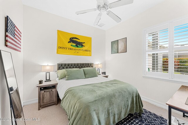 1172 Vestavia Cir, Melbourne, FL 32940 - bedroom with light colored carpet, baseboards, and a ceiling fan
