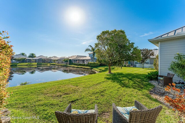 1172 Vestavia Cir, Melbourne, FL 32940 - view of green lawn with a water view and a residential view