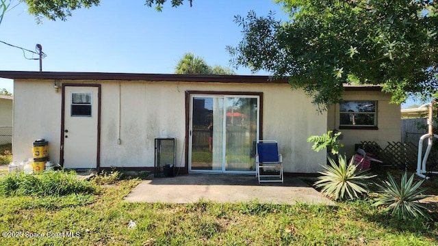 2327 Sadler Ln, Melbourne, FL 32935 - back of property with a patio