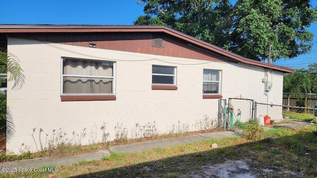 2327 Sadler Ln, Melbourne, FL 32935 - view of side of property with concrete block siding