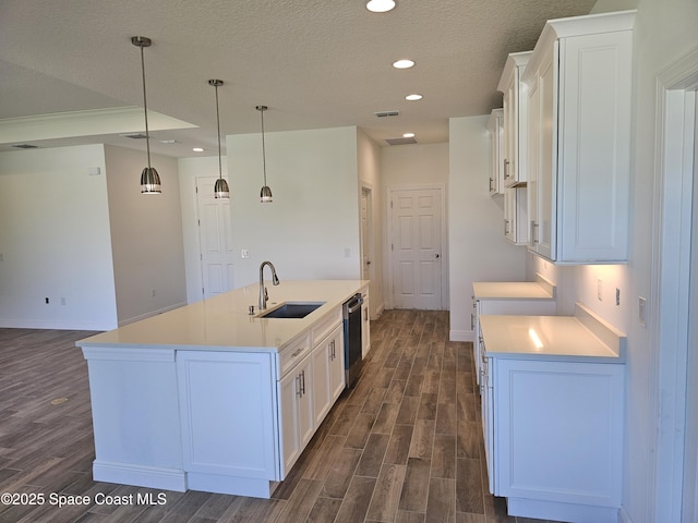 571 Fondulac St, Palm Bay, FL 32908 - kitchen with dark wood-style flooring, dishwasher, white cabinets, light countertops, and recessed lighting