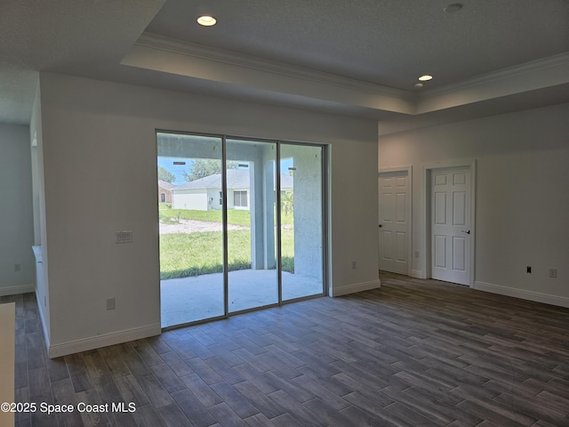 571 Fondulac St, Palm Bay, FL 32908 - empty room with a raised ceiling, ornamental molding, dark wood finished floors, and recessed lighting