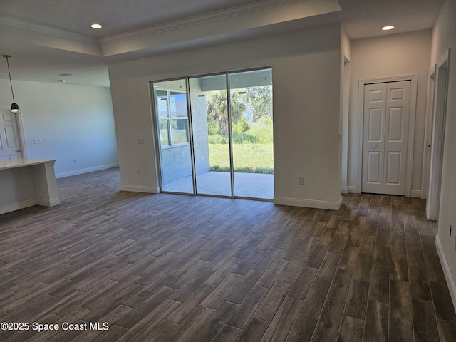 571 Fondulac St, Palm Bay, FL 32908 - unfurnished living room with dark wood-type flooring, crown molding, a tray ceiling, and recessed lighting