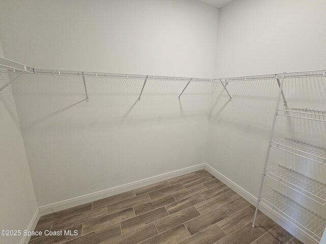 571 Fondulac St, Palm Bay, FL 32908 - walk in closet featuring wood tiled floors