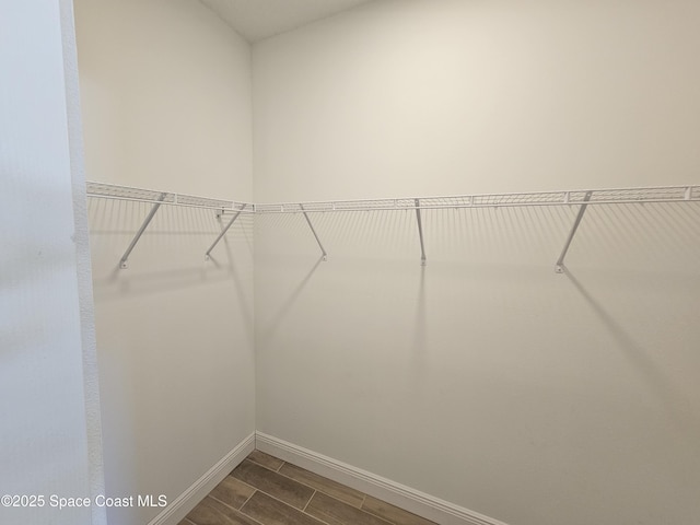 571 Fondulac St, Palm Bay, FL 32908 - spacious closet featuring wood finish floors