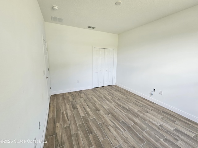 571 Fondulac St, Palm Bay, FL 32908 - unfurnished bedroom featuring wood finished floors and a closet