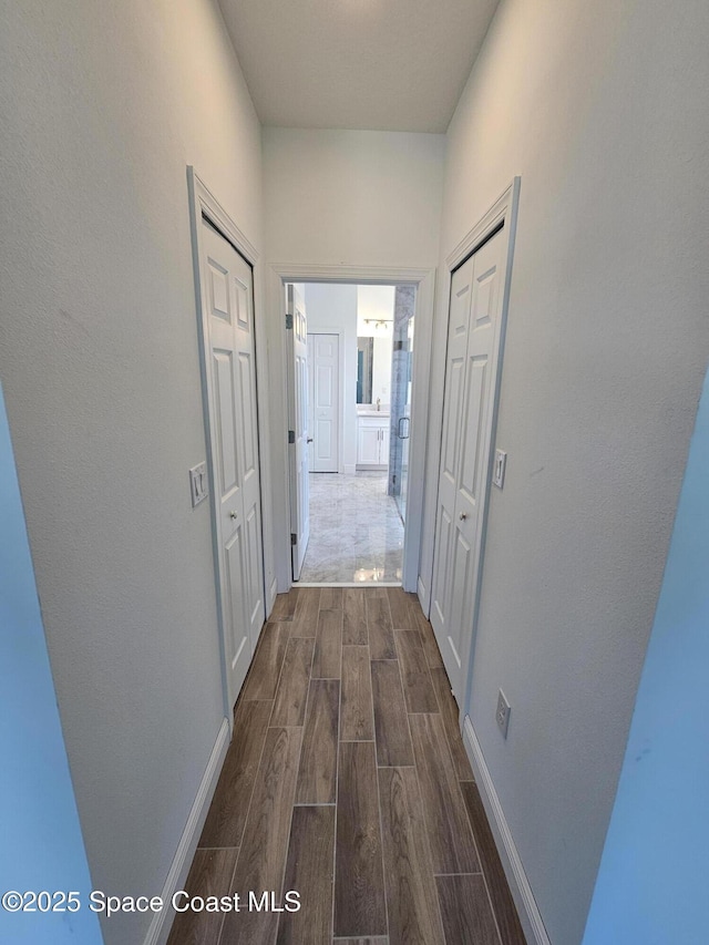 571 Fondulac St, Palm Bay, FL 32908 - hallway with wood finish floors and baseboards