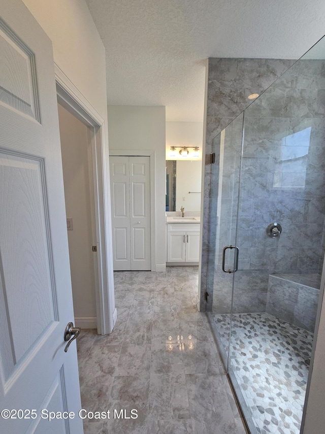 571 Fondulac St, Palm Bay, FL 32908 - bathroom with vanity, a shower stall, and a textured ceiling