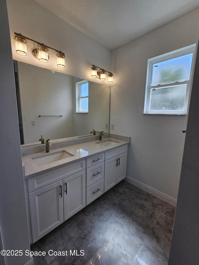 571 Fondulac St, Palm Bay, FL 32908 - bathroom featuring double vanity and a textured ceiling
