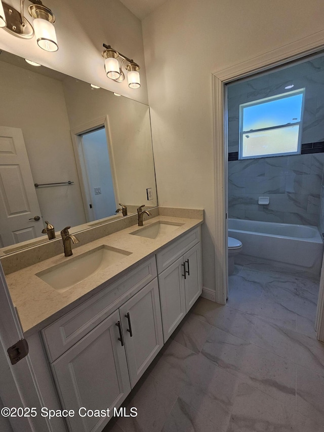 571 Fondulac St, Palm Bay, FL 32908 - full bathroom with double vanity, marble look tiles, and  shower combination