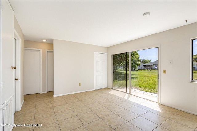 933 Gueld Ave NE, Palm Bay, FL 32905 - spare room featuring a smoke detector and light tile patterned floors