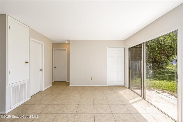 933 Gueld Ave NE, Palm Bay, FL 32905 - spare room with baseboards and light tile patterned flooring