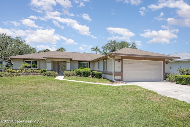 960 Mayflower Ave, Melbourne, FL 32940 - ranch-style house with stucco siding, an attached garage, driveway, and a front yard