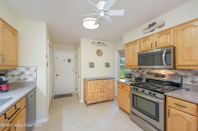 960 Mayflower Ave, Melbourne, FL 32940 - kitchen featuring appliances with stainless steel finishes, light brown cabinets, tasteful backsplash, ceiling fan, and light countertops