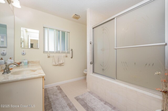 960 Mayflower Ave, Melbourne, FL 32940 - full bath featuring vanity, toilet, baseboards, tile patterned flooring, and enclosed tub / shower combo