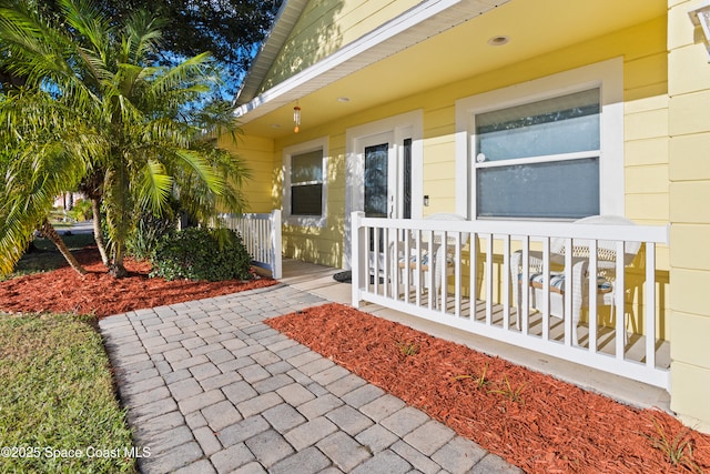 2922 Brandywine Cir, Titusville, FL 32796 - doorway to property featuring covered porch