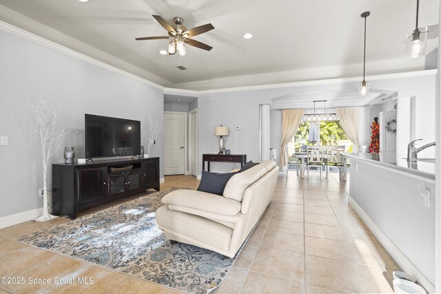 2922 Brandywine Cir, Titusville, FL 32796 - living area with light tile patterned flooring, ceiling fan, ornamental molding, baseboards, and recessed lighting