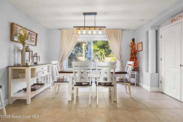 2922 Brandywine Cir, Titusville, FL 32796 - dining space with light tile patterned floors and baseboards