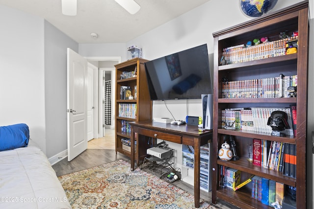 2922 Brandywine Cir, Titusville, FL 32796 - office with wood finished floors, baseboards, and a ceiling fan
