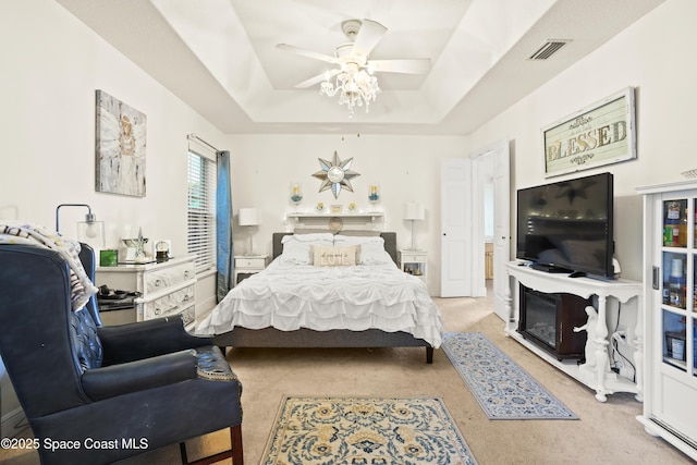 2922 Brandywine Cir, Titusville, FL 32796 - carpeted bedroom featuring a raised ceiling and ceiling fan