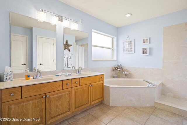 2922 Brandywine Cir, Titusville, FL 32796 - full bathroom featuring double vanity, a garden tub, and tile patterned floors