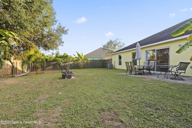 2922 Brandywine Cir, Titusville, FL 32796 - view of yard featuring a patio and central AC unit