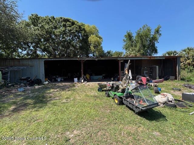 3050 Kittles St, Mims, FL 32754 - rear view of property with a yard, an outbuilding, and an outdoor structure