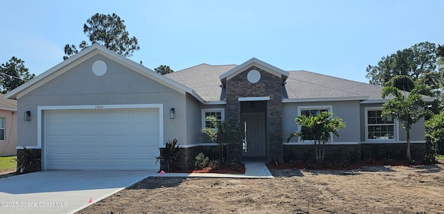 2999 Gaffney Ave SE, Palm Bay, FL 32909 - view of front of house with stone siding, concrete driveway, an attached garage, stucco siding, and a shingled roof