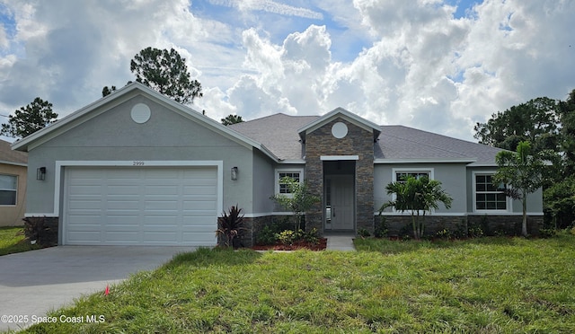 2999 Gaffney Ave SE, Palm Bay, FL 32909 - single story home with stone siding, concrete driveway, a front yard, an attached garage, and stucco siding