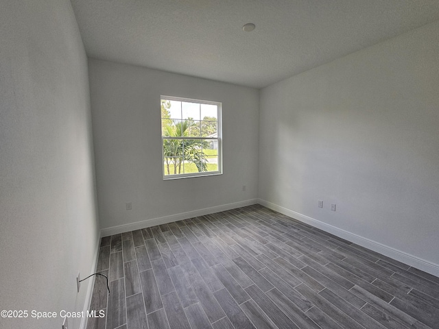 2999 Gaffney Ave SE, Palm Bay, FL 32909 - unfurnished room featuring dark wood finished floors and baseboards