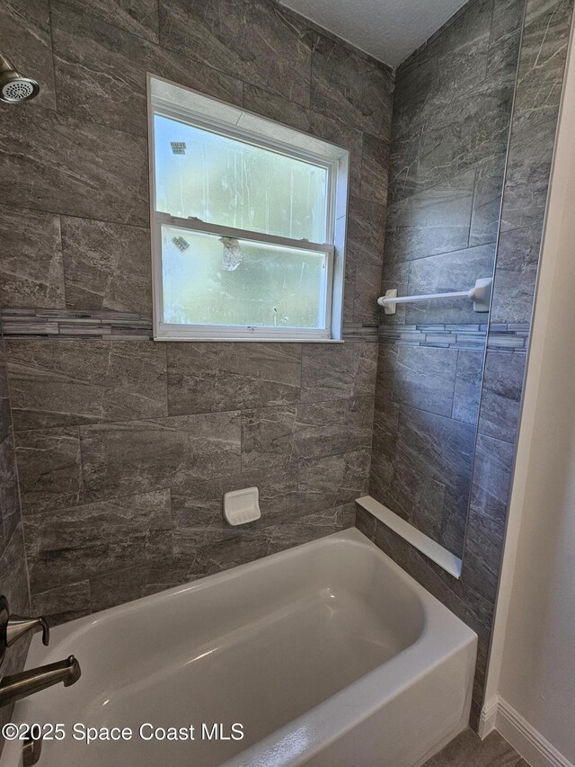 2999 Gaffney Ave SE, Palm Bay, FL 32909 - full bathroom featuring  shower combination and baseboards