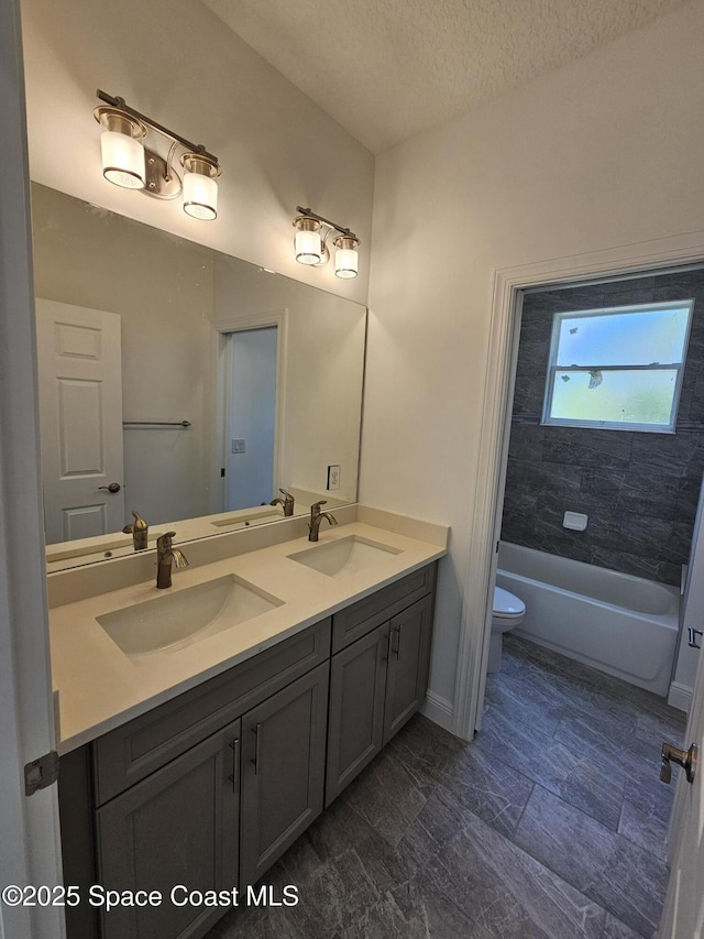 2999 Gaffney Ave SE, Palm Bay, FL 32909 - bathroom featuring double vanity and a textured ceiling