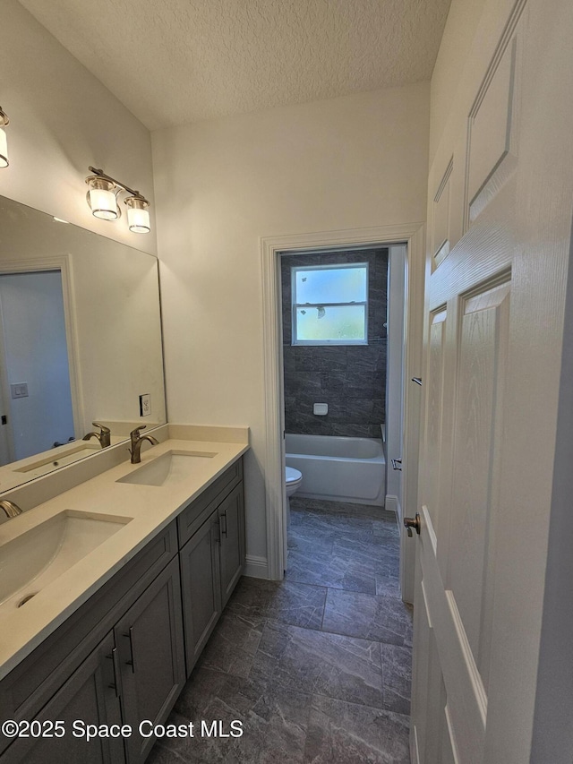 2999 Gaffney Ave SE, Palm Bay, FL 32909 - full bath with double vanity and a textured ceiling