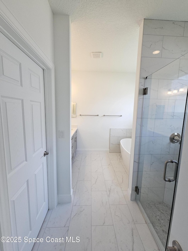 2999 Gaffney Ave SE, Palm Bay, FL 32909 - bathroom featuring marble finish floors, a shower stall, a freestanding tub, and vanity