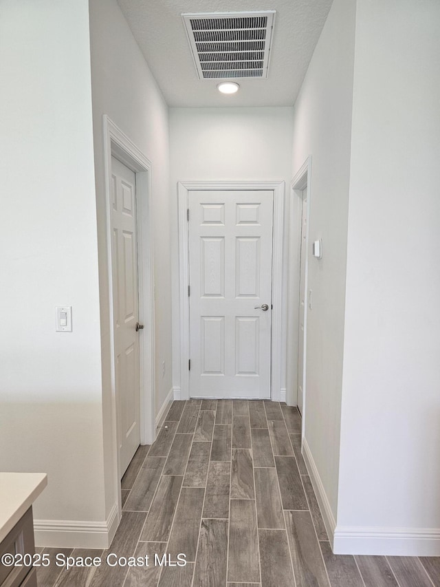 2999 Gaffney Ave SE, Palm Bay, FL 32909 - hall featuring wood finish floors and baseboards