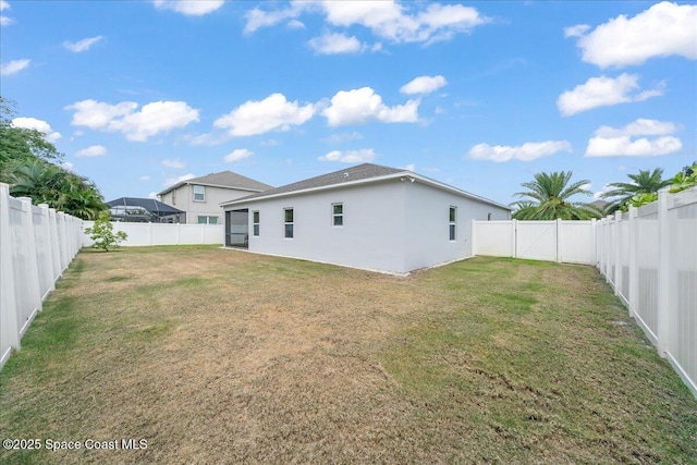 4570 Hebron Dr, Merritt Island, FL 32953 - rear view of property with stucco siding