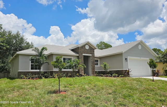 431 Falls Church St SW, Palm Bay, FL 32908 - ranch-style house with stone siding, an attached garage, stucco siding, a front yard, and driveway